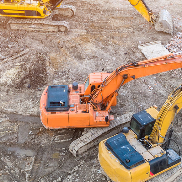 Walkers Bau - Bagger bei Fundamentarbeiten